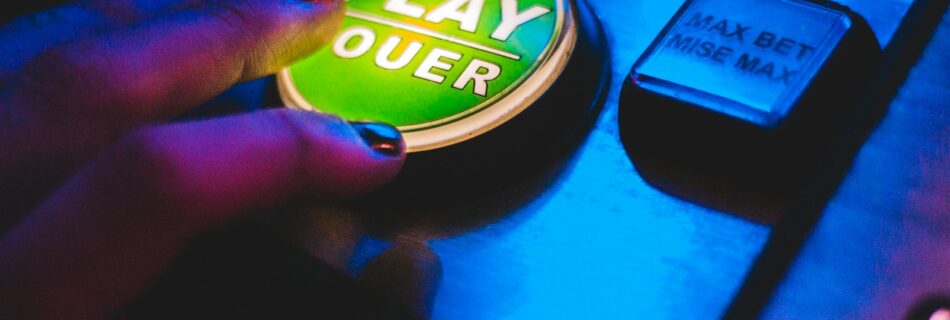 person touching play button